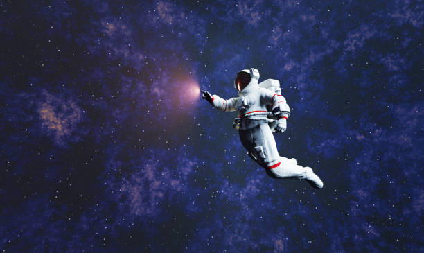 Astronaut spacewalk in space and touching orb of light. stock photo