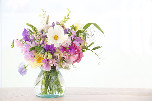 Mixed flowers bouquet on white