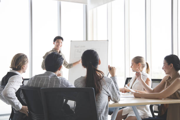 istock Business people discussing together in conference. 1413585486