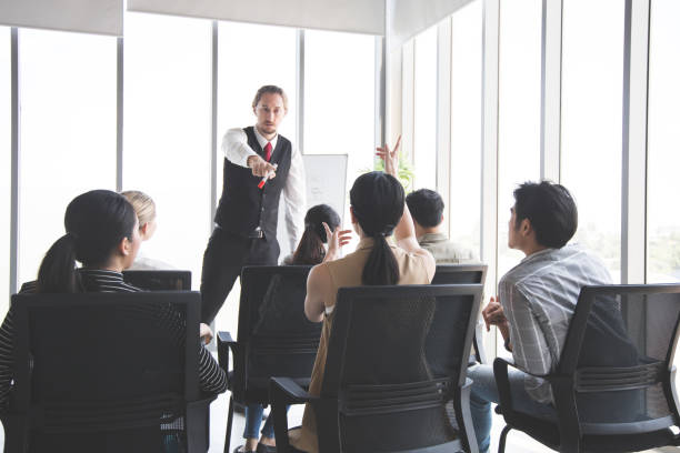 istock Team meeting to analyze assignments. 1413585488