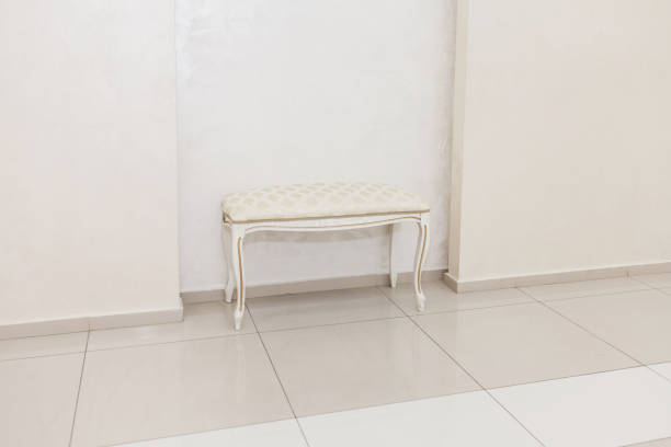 Mid-century modern Ottoman stool on white background with clipping path