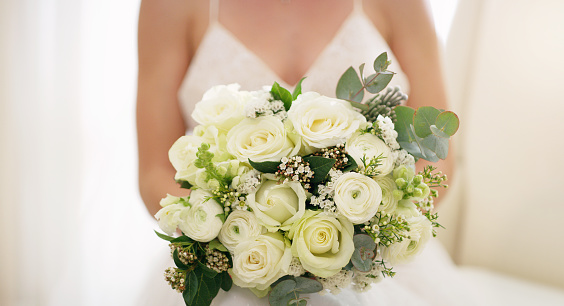 Beautiful bride holding a bridal bouquet at her wedding