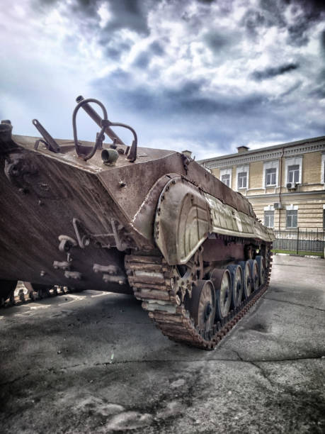istock Old army tank standing in a town square 1413589647
