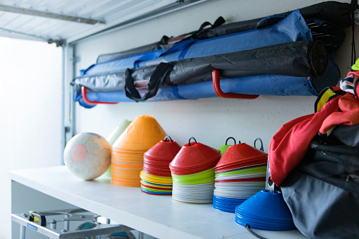Football equipment in a generic storage space
