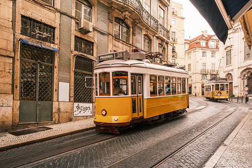 yellow tram in street of  Lisbon, Portugal, retro toned