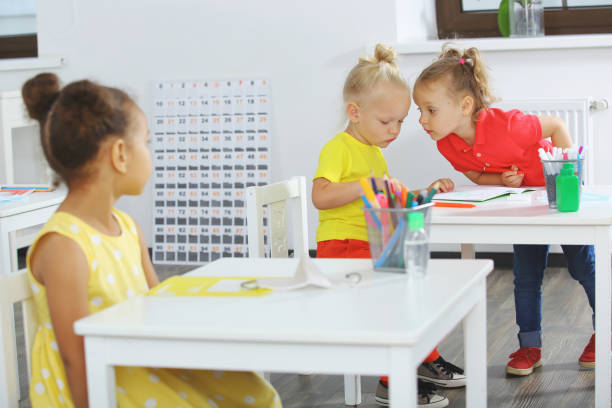 istock a fragment of a lesson in elementary school classroom. Students in the classroom are sitting at desks 1413591838