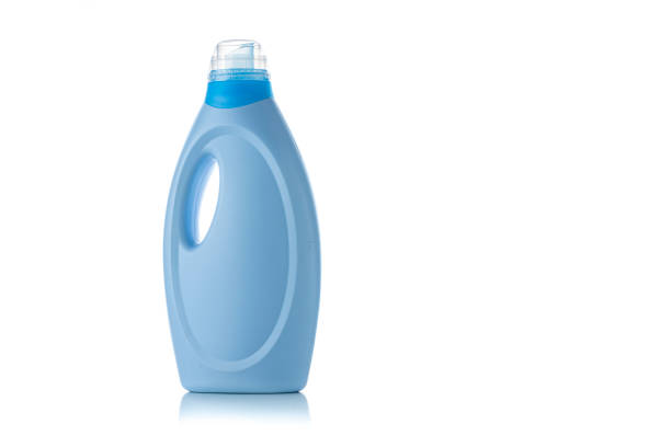 Front wiew of a blue plastic bottle of fabric softener or detergent isolated on white background. Copy space. High resolution 42Mp studio digital capture taken with Sony A7rII and Sony FE 90mm f2.8 macro G OSS lens