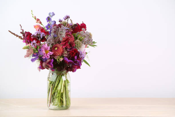 istock Mixed flowers bouquet on white 1413593431