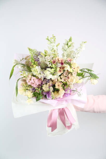 istock Mixed flowers bouquet on white 1413593440