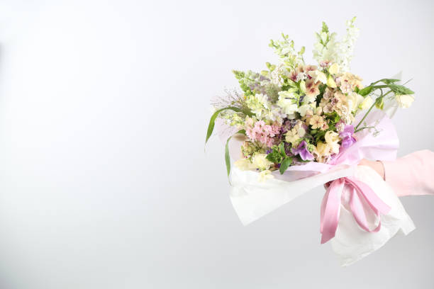 istock Mixed flowers bouquet on white 1413593442