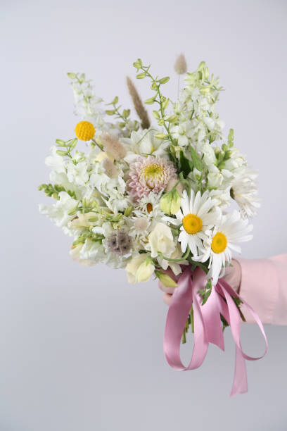 istock Mixed flowers bouquet on white 1413593460