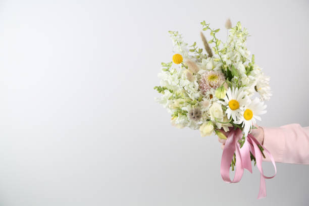 istock Mixed flowers bouquet on white 1413593487
