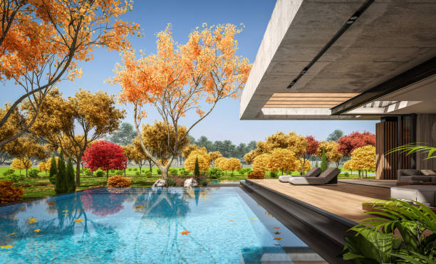 3d rendering of new concrete house in modern style in autumn day stock photo