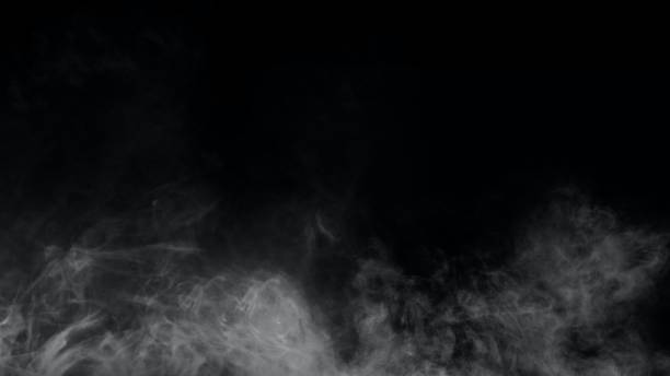 istock White smoke or fog isolated on black background. 1413596346