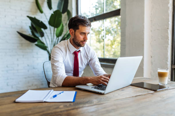 istock Adult student attending online course or seminar, working on laptop 1413596541