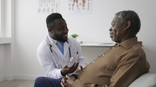Senior male patient discussing with a doctor