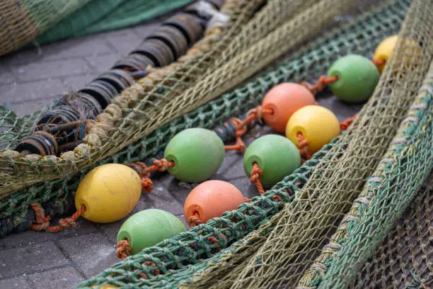 Colored nets and ropes on a quay of a Dutch harbour