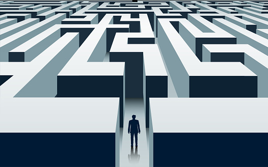 Businessman stands in front of a labyrinth. Problem solving and business opportunities. Vector illustration