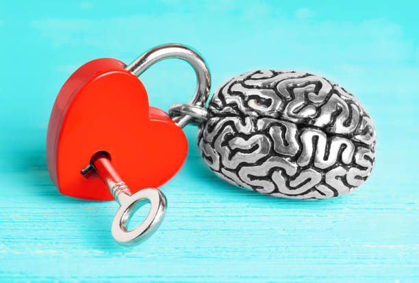 istock Steel brain attached to a heart-shaped padlock 1413600705
