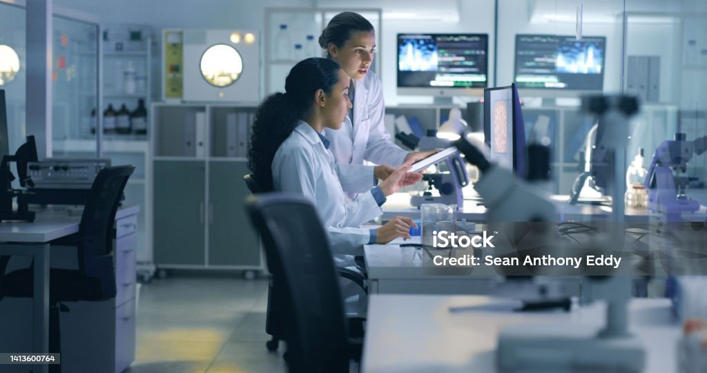 Drug trial, medical research or examination of a scan being done by doctors, researchers or scientists in a lab. Experts, medical professionals or biologists talking and discussing results of a test Laboratory Stock Photo