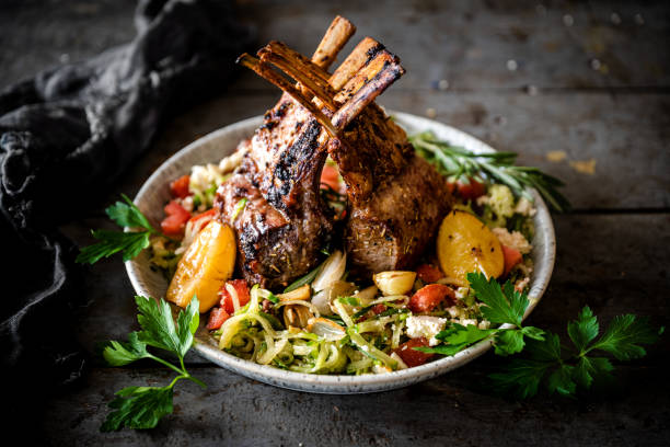 Rack of lamb with roasted vegetables stock photo