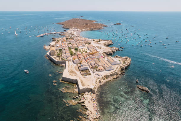 aerial view of tabarca island with boats at anchor. mediterranean sea. popular travel destinations at summer. spain. - island of tabarca imagens e fotografias de stock