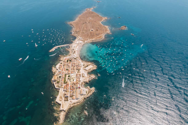 aerial view of tabarca island with boats at anchor. mediterranean sea. popular travel destinations at summer. spain. - island of tabarca imagens e fotografias de stock