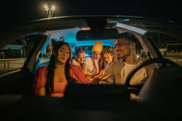 istock Friends sitting in car 1413603781
