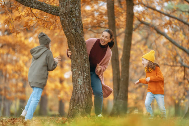 istock Happy family on autumn walk 1413604555