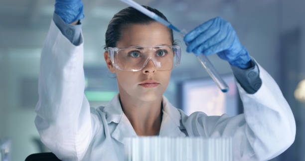 istock Scientist, forensic pathologist and medical professional researching innovative diseases with a dropper and test tubes in a lab. An expert analyzing samples to develop a cure, vaccine or treatment 1413606316