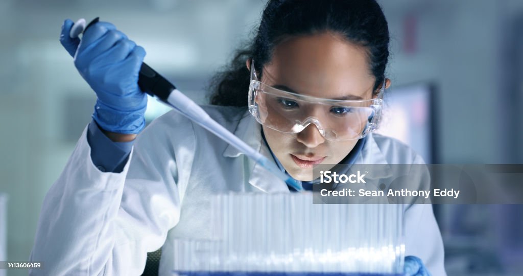 Research, experiment and medical trial being done by a scientist in a lab, science facility or hospital. One young, serious and professional researcher organizing, sorting or making a discovery Research, experiment and trial being done by a scientist in a lab, science facility or hospital. One young, serious and professional medical researcher organizing, sorting or making a discovery Laboratory Stock Photo