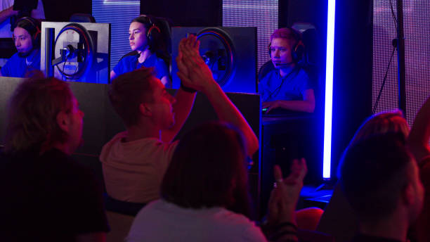 istock Audience watching esport video game championship on a huge display screen. Cheering and clapping for their favorite players 1413607786