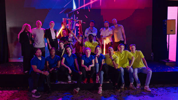 esport competing teams with african ethnicity players at video game championship posing for a group picture - esport audience bildbanksfoton och bilder