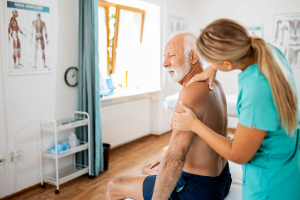 istock Young physiotherapist working with a senior male patient with shoulder problems 1413608756