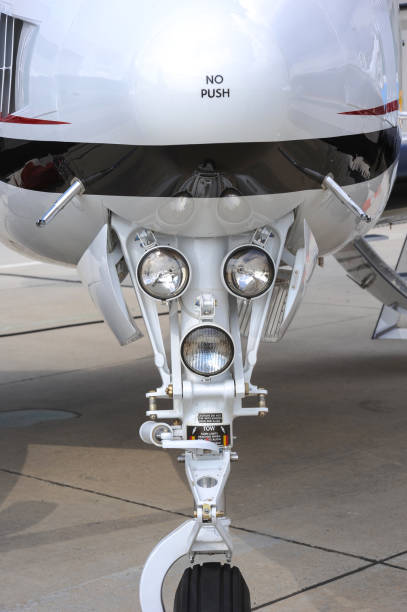 istock Front landing gear and lamps of private plane 1413609096