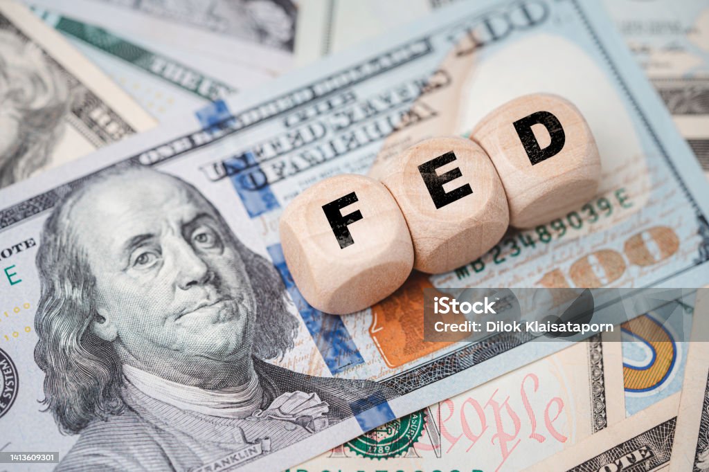 FED wording with up and down arrow on USD dollar banknote for Federal reserve increase and decrease interest rate control which effect to America and world economic growth concept. Inflation - Economics Stock Photo