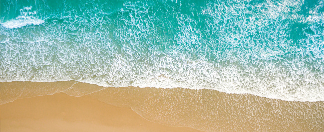 Top view aerial image from drone of an stunning beautiful sea landscape beach with turquoise water with copy space for your text. Beautiful Sand beach with turquoise water, aerial UAV drone shot