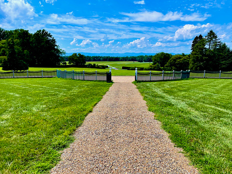 Montpelier Station, Virginia, USA - July 30, 2022: View of the front lawn and the approach to “Montpelier”, home of United States President and Founding Father James Madison and his wife Dolley Madison.