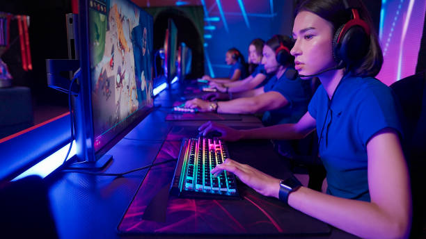 Pro gamer team with female leader competing in video game eSport championship stock photo