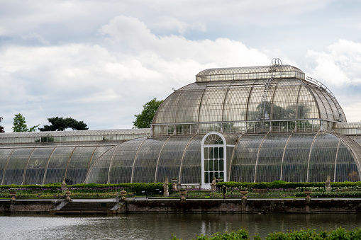 Kew Gardens Palm House of Kew Gardens in Greater London. Royal Botanic Gardens are designated as UNESCO World Heritage Site. On a rainy day.