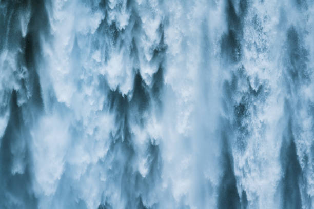 istock Powerful large natural waterfall flowing from cliff in summer 1413621318
