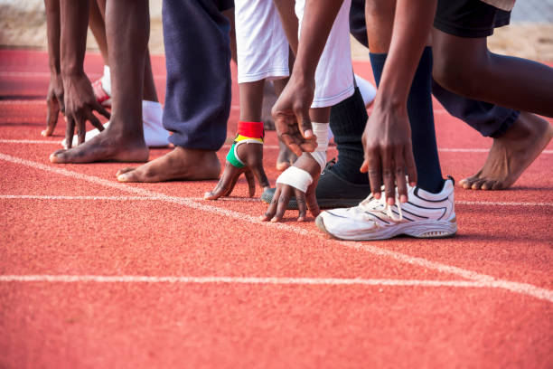 paralympic runners paralympic games african runners on the track some of them running barefoot paralympic games stock pictures, royalty-free photos & images