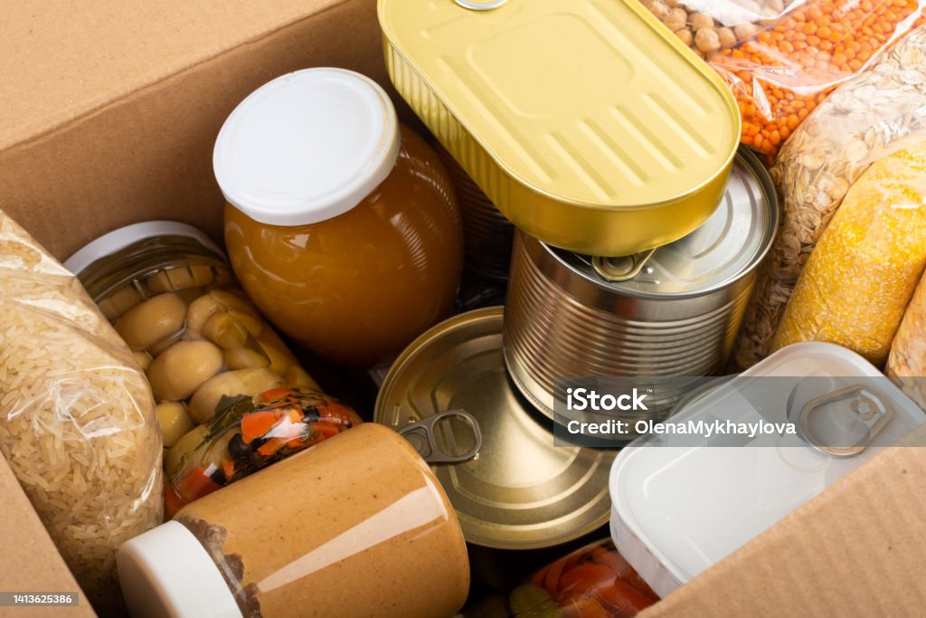 Survival set of nonperishable foods in carton box Box - Container Stock Photo