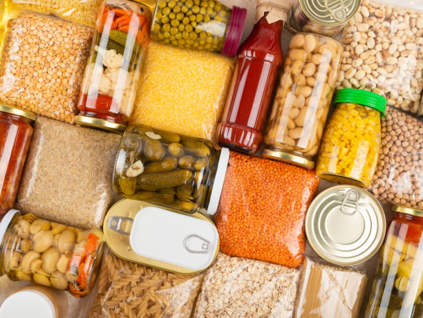 istock Emergency survival groceries on kitchen table closeup flat lay 1413625406