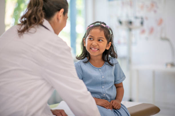 istock Little Girl at a Doctors Appointment 1413627739
