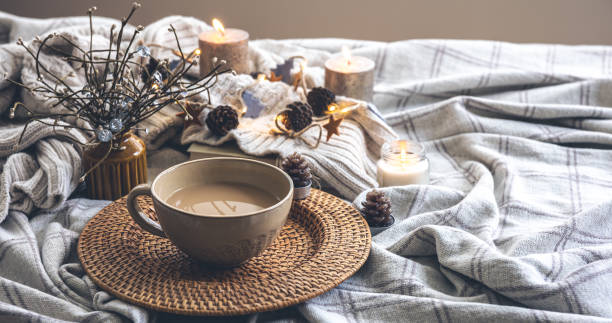 istock Cozy autumn composition with a big cup of coffee in bed. 1413630523