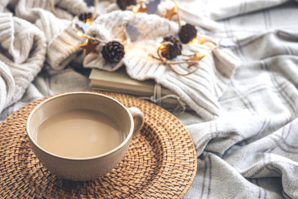 istock Cozy autumn composition with a big cup of coffee in bed. 1413630527