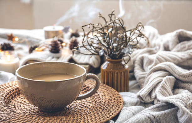 istock Cozy autumn composition with a big cup of coffee in bed. 1413630528