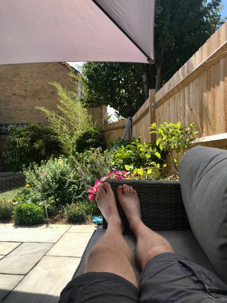 istock Man’s legs on outdoor sofa 1413632235