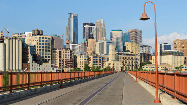istock Minneapolis Skyline + Stone Arch Bridge 1413632237